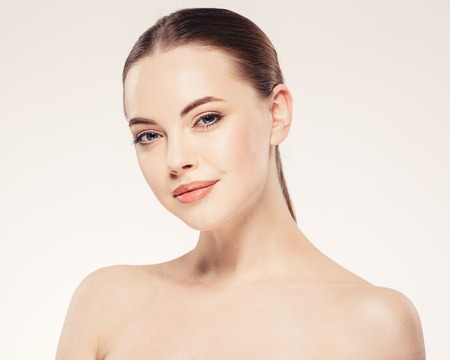 Beautiful woman face close up portrait young. Isolatedon white. Studio shot.の写真素材