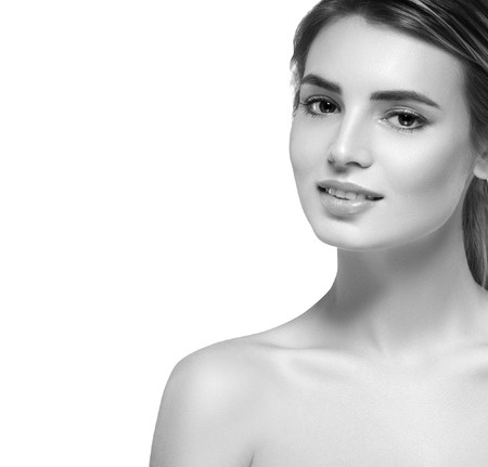 Beautiful woman portrait face. Isolated on white. Black and white. Studio shot.の写真素材