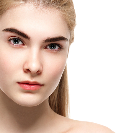 Blonde woman beauty portrait close-up isolated on white. Studio shot.の写真素材