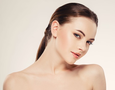 Beautiful woman face close up portrait young. Isolatedon white. Studio shot.の写真素材