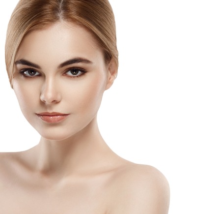 Beautiful woman face close up portrait young . Isolated on white. Studio shot.の写真素材