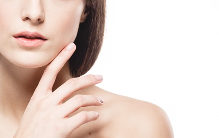 Woman shoulders lips hands fingers close-up portrait. Studio shot.の写真素材