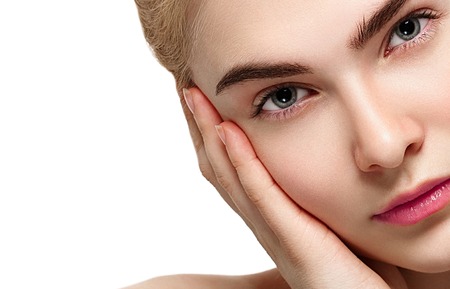 Blonde woman beauty portrait close-up isolated on white. Studio shot.の写真素材