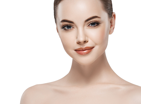 Beautiful woman face close up portrait young. Isolated on white. Studio shot.の写真素材