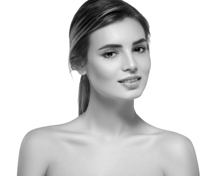 Beautiful woman portrait face. Isolated on white. Black and white. Studio shot.の写真素材
