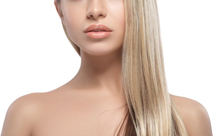 Lips shoulders chin nose smile Beautiful woman blond portrait face. Studio shotの写真素材