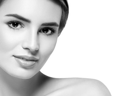 Beautiful woman portrait face. Isolated on white. Black and white. Studio shot.の写真素材