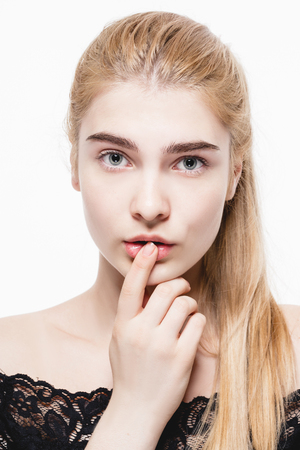 Blonde woman beauty portrait close-up isolated on white. Studio shot.の写真素材