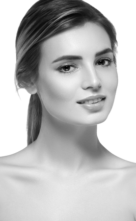 Beautiful woman portrait face. Isolated on white. Black and white. Studio shot.の写真素材