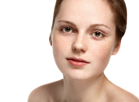 Woman beauty portrait closeup with healthy skin.  Studio shot. Isolated on white.の写真素材