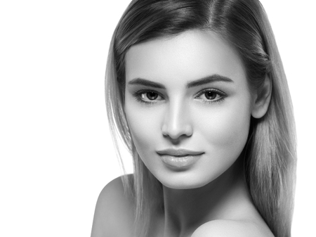 Beautiful woman portrait face. Isolated on white. Black and white. Studio shot.の写真素材