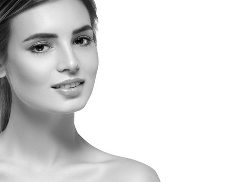 Beautiful woman portrait face. Isolated on white. Black and white. Studio shot.の写真素材