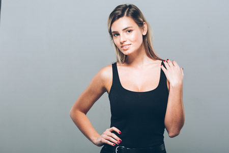 Beautiful young woman portrait smiling posing attractive blond. Studio shot.の写真素材