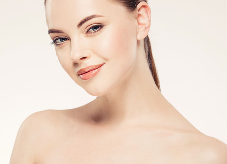 Beautiful woman face close up portrait young. Isolatedon white. Studio shot.の写真素材