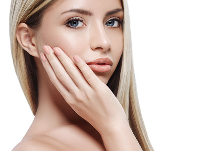 Blonde woman beauty portrait close-up. isolated on white. Studio shot.の写真素材