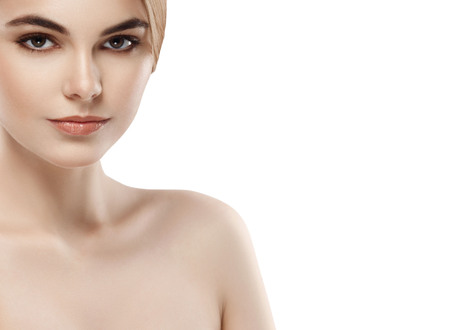 Beautiful woman face close up portrait young . Isolated on white. Studio shot.の写真素材