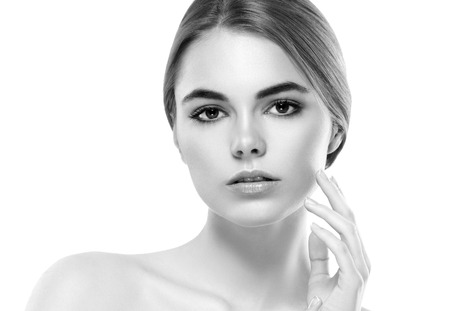 Blonde woman beauty portrait close-up. Isolated on white. Black and white. Studio shot.の写真素材