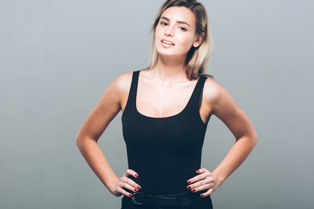 Beautiful young woman portrait smiling posing attractive blond. Studio shot.の写真素材