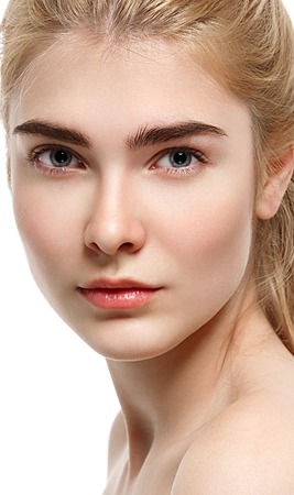 Blonde woman beauty portrait close-up isolated on white. Studio shot.の写真素材