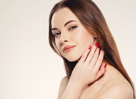 Woman beauty portrait isolated on white close up female face. Studio shot.の写真素材