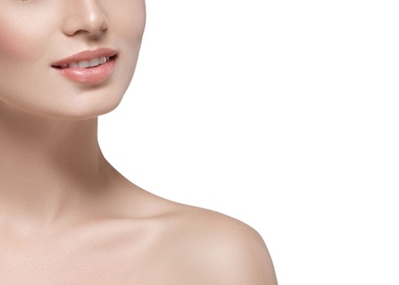 Shoulders neck lips Beautiful woman face close up portrait young. Isolated on white. Studio shot.の写真素材