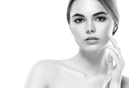 Blonde woman beauty portrait close-up. Isolated on white. Black and white. Studio shot.の写真素材