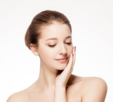 Beautiful woman face close up portrait young studio on white. Studio shot.の写真素材