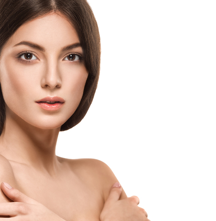 Beautiful woman face close up portrait young. Studio shot. Isolated on white.の写真素材