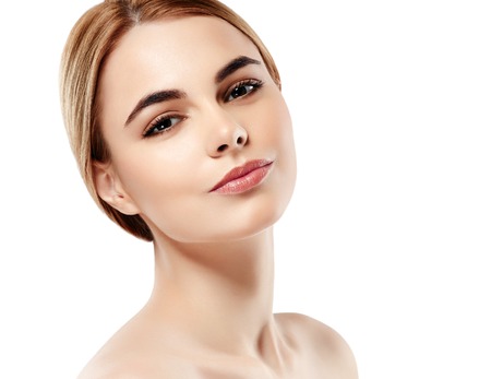 Beautiful woman face with sexy lips. Studio shot. Isolated on white.の写真素材