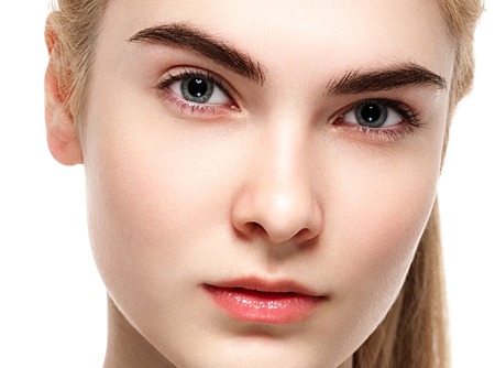 Blonde woman beauty portrait close-up isolated on white. Studio shot.の写真素材