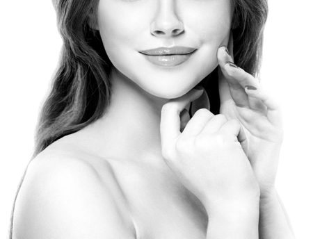 Lips nose neck Beautiful woman face close up. Isolated on white. black and white. Studio shot.の写真素材