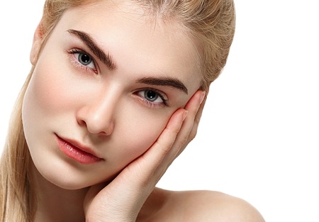 Blonde woman beauty portrait close-up isolated on white. Studio shot.の写真素材