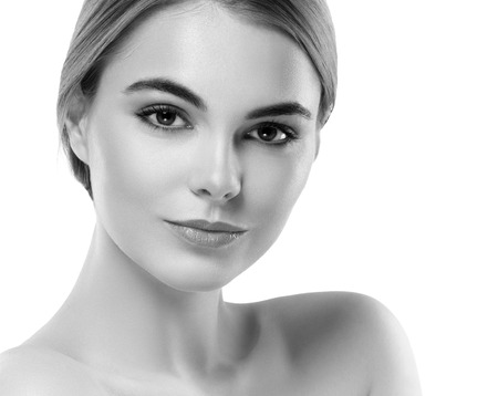 Blonde woman beauty portrait close-up. Isolated on white. Black and white. Studio shot.の写真素材