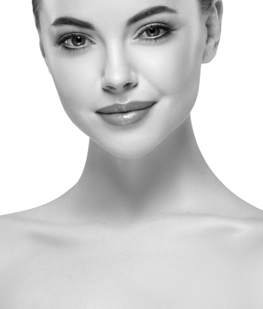 Beautiful woman face close up portrait young. Isolated on white. Black and white. Studio shot.の写真素材