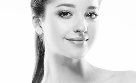 Beautiful woman portrait face. Isolated on white. Black and white. Studio shot.の写真素材