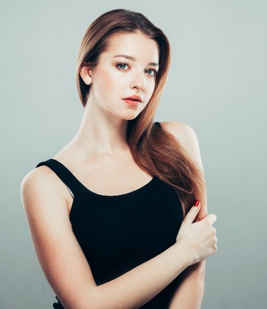 Beautiful young woman portrait smiling posing attractive. Studio shot.の写真素材