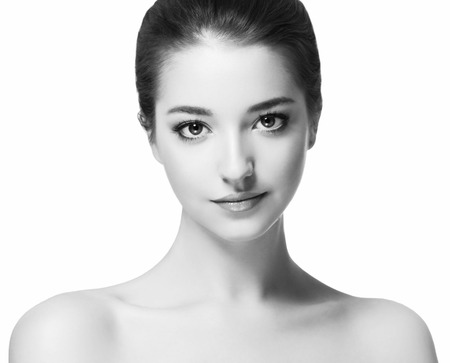 Beautiful woman portrait face. Isolated on white. Black and white. Studio shot.の写真素材