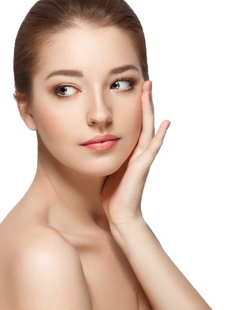 Beautiful woman face close up portrait young. Isolated on white. Studio shot.の写真素材