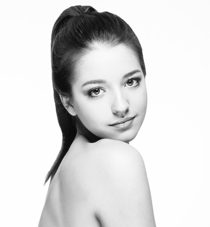 Beautiful woman portrait face. Isolated on white. Black and white. Studio shot.の写真素材