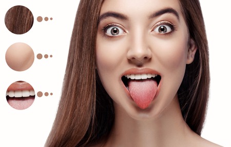 Skin problem women face. Women shows her tongue. Studio shot.の写真素材