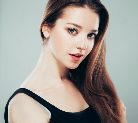 Beautiful young woman portrait smiling posing attractive. Studio shot.の写真素材