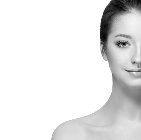 Beautiful woman portrait face. Isolated on white. Black and white. Studio shot.の写真素材