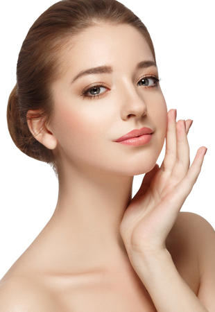 Beautiful woman face close up portrait young. Isolated on white. Studio shot.の写真素材
