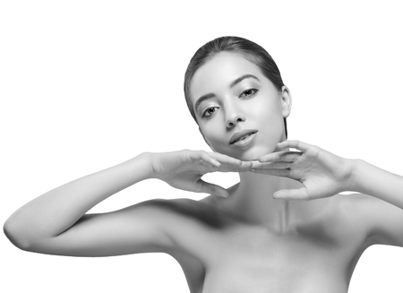 Beautiful woman portrait face. Isolated on white. Black and white. Studio shot.の写真素材