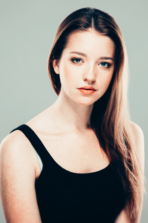 Beautiful young woman portrait smiling posing attractive. Studio shot.の写真素材