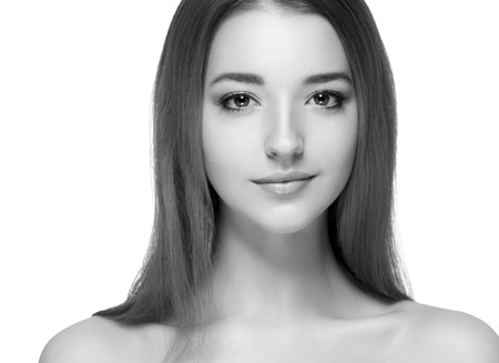 Beautiful woman portrait face. Isolated on white. Black and white. Studio shot.の写真素材