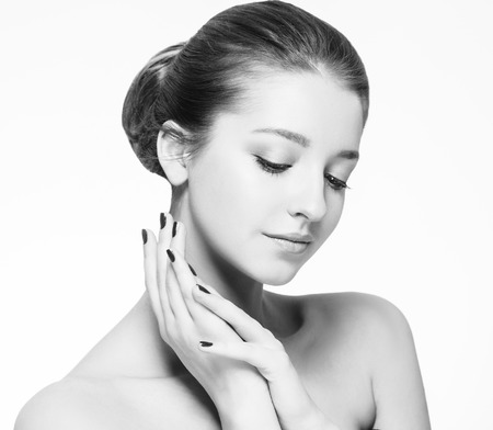 Beautiful woman portrait face. Isolated on white. Black and white. Studio shot.の写真素材