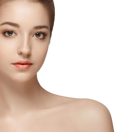 Beautiful woman face close up portrait young. Isolated on white. Studio shot.の写真素材