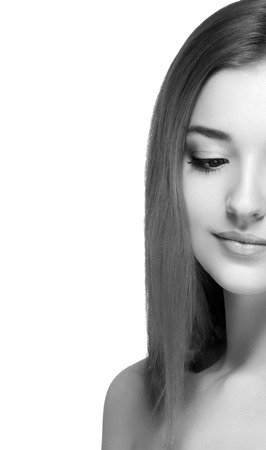 Beautiful woman portrait face. Isolated on white. Black and white. Studio shot.の写真素材