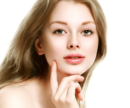 Beautiful woman face close up portrait young. Isolated on white. Studio shot.の写真素材